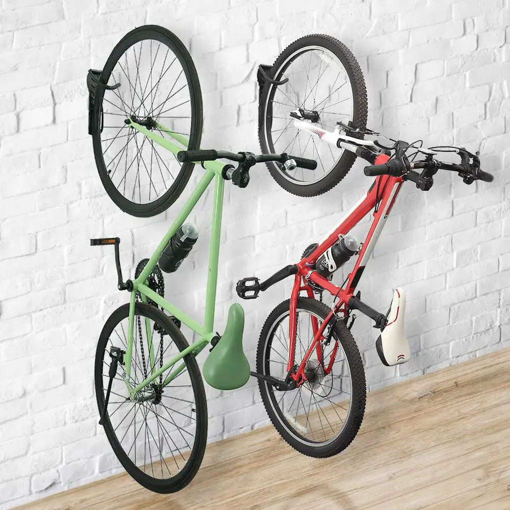 bikes hanging vertically from wall hooks